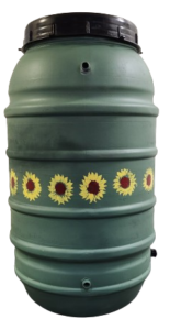 A rain barrel painted green with sunflowers in a row around the center